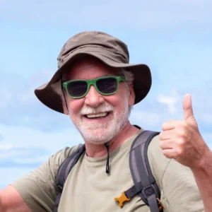 happy-active-senior-man-with-backpack-and-hat-whil-2026-01-05-23-28-06-utc.webp
